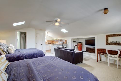 A spacious primary bedroom at the Luna Rio retreat house with soft natural light.